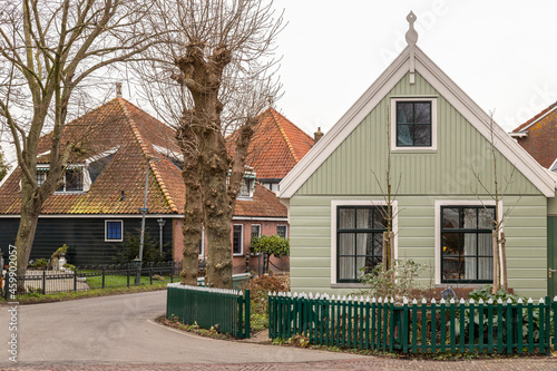 Fototapeta Naklejka Na Ścianę i Meble -  Wooden traditional houses in the small village of Zuiderwoude in the municipality of Waterland in the Dutch province of North Holland.