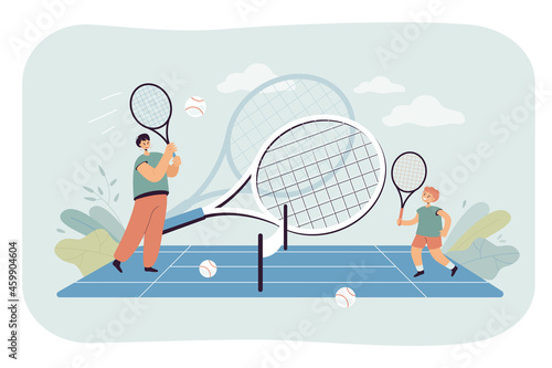 Female coach or mother and boy playing junior tennis together. Woman and kid hitting balls with rackets flat vector illustration. Sports camp or academy concept for banner or landing web page