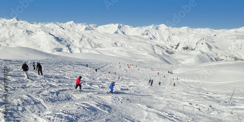 Fototapeta Panorama of skiers on a ski slope, the Alps, France