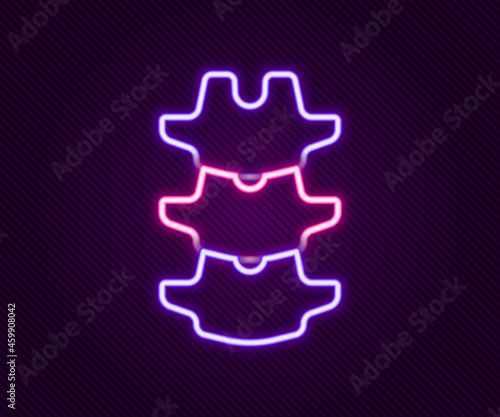 Glowing neon line Human spine icon isolated on black background. Colorful outline concept. Vector
