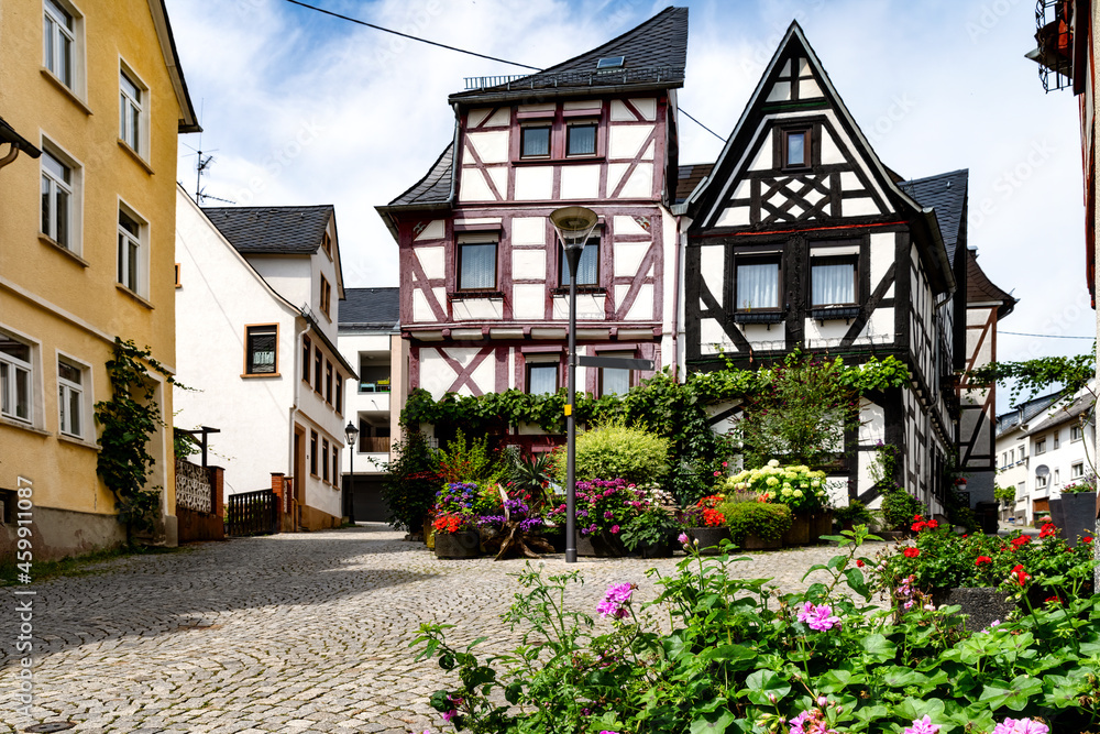 Half-timbered houses with blooming flowers in foreground in the old town of Montabaur, Germany