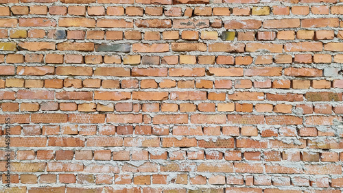 Brick wall not plastered, masonry seams are visible.