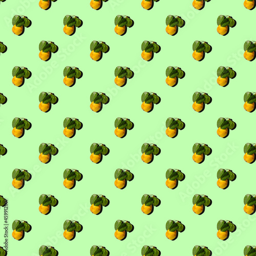 Ripe juicy yellow pears with green leaves on a colored background. Seamless patterns.