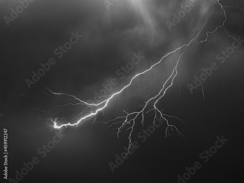 Lightning bolt with many side branches high up in the sky