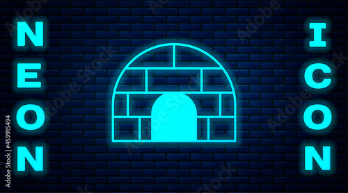 Glowing neon Igloo ice house icon isolated on brick wall background. Snow home, Eskimo dome-shaped hut winter shelter, made of blocks. Vector