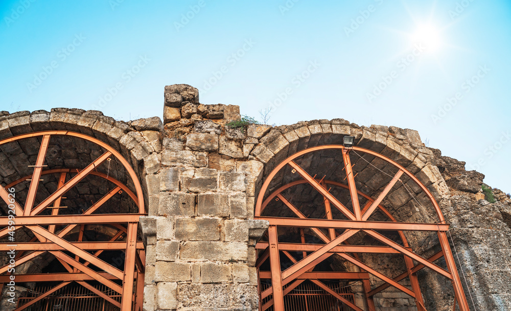 Arch of the amphitheater of the ancient city, reinforced with metal beams.