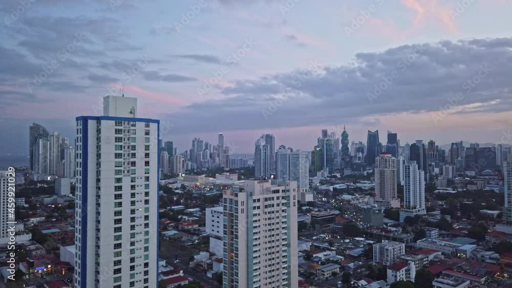 Sunset over big clean city for lifestyle and commerce business. People moving and traffic. Sunset over big clean city for lifestyle and commerce business. People moving and traffic.