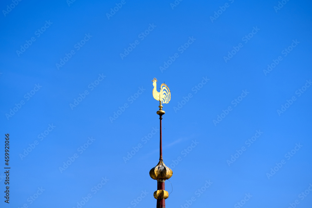Wind vane of protestant church Great Minster in shape of a golden rooster at the old town of Zürich. Photo taken September 8th, 2021, Zurich, Switzerland. Wind vane of protestant church Great Minster in shape of a golden rooster at the old town of Zürich. Photo taken September 8th, 2021, Zurich, Switzerland.