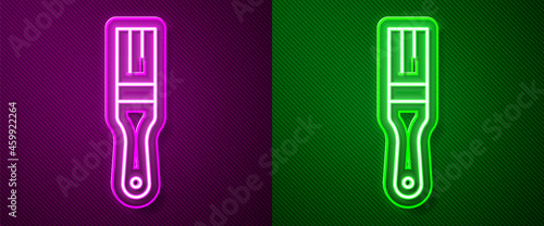 Glowing neon line Paint brush icon isolated on purple and green background. Vector