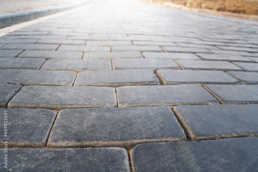 Obraz premium Gray stone pavement and front light.