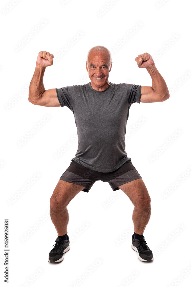 Elderly retired man, athlete, raised his hands up, celebrating victory and success. On white background.