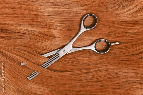 Hair cutting concept with shiny hair and thinning shears