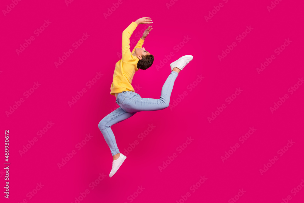 Full length body size view of attractive sportive girl jumping dancing moving isolated over bright pink color background