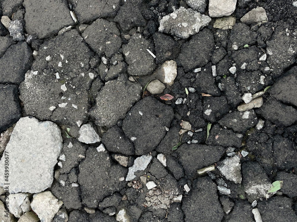 Broken asphalt texture close up Broken asphalt texture close up