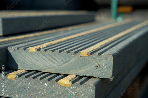 Close-up of circular construction material made from re-used waste plastics on a recycling plant photo