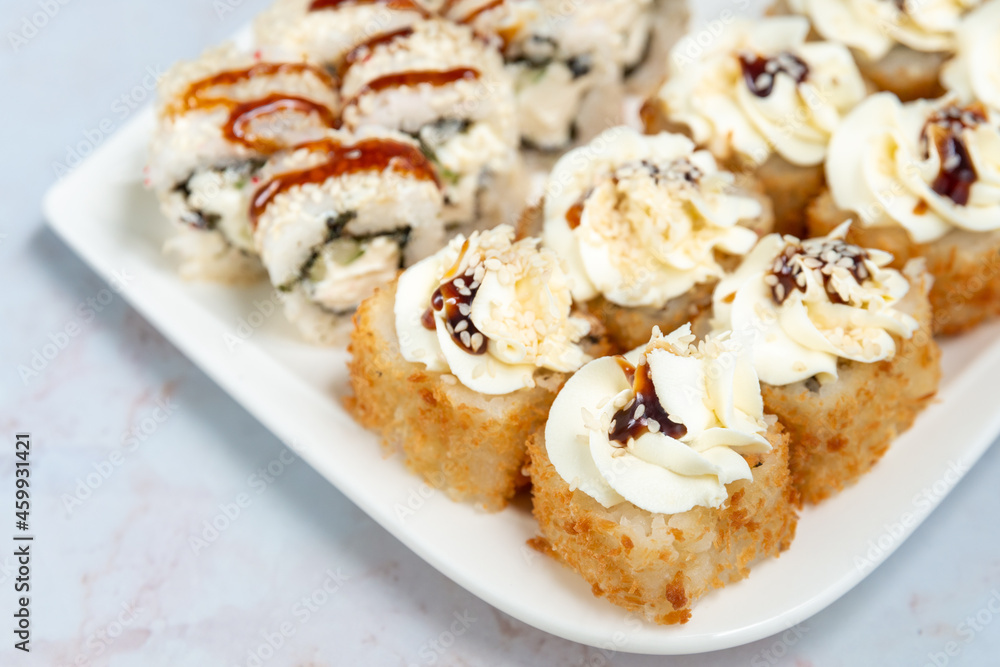 sushi rolls on a white plate on a white background sushi rolls on a white plate on a white background