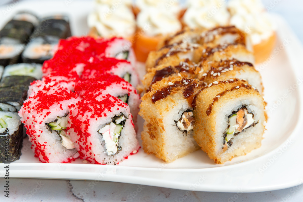 sushi rolls on a white plate on a white background sushi rolls on a white plate on a white background