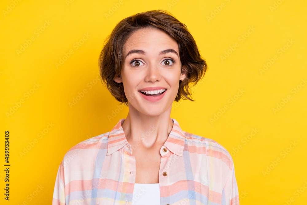 Photo of cheerful young happy woman sale news reaction face enjoy isolated on shine yellow color background Photo of cheerful young happy woman sale news reaction face enjoy isolated on shine yellow color background