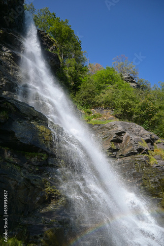 Vertical image of water falling from falls on the Norwegian mountains in Geiranger