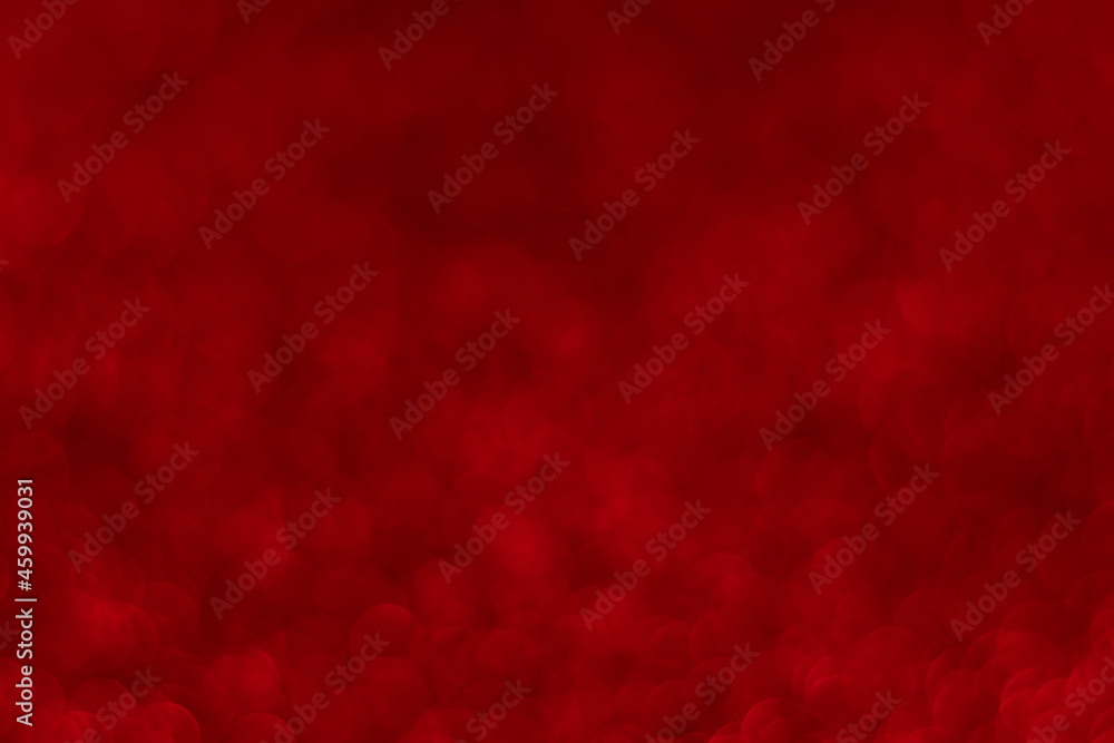 Red sparkling glitter bokeh background, christmas abstract defocused texture. Holiday lights