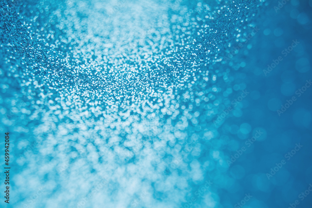 Abstract shiny blurred blue background. Textured glittering backdrop Abstract shiny blurred blue background. Textured glittering backdrop