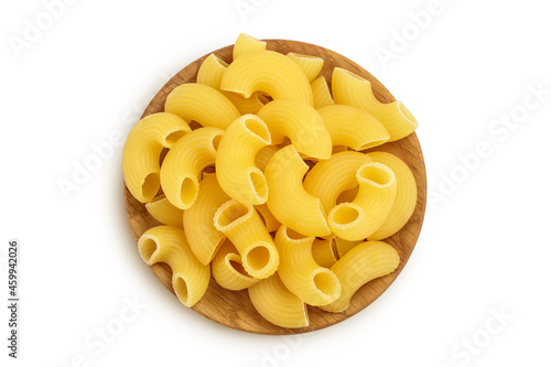 raw macaroni pasta in wooden bowl isolated on white background with clipping path and full depth of field. Top view. Flat lay