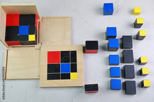 Montessori binomial and trinomial cubes