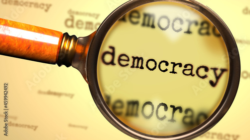 Canvas Print Democracy and a magnifying glass on English word Democracy to symbolize studying