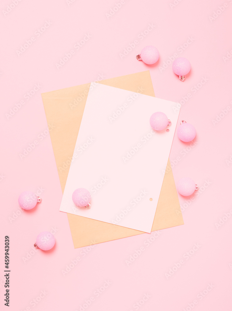 Top view of Christmas composition on pastel pink background. Holiday greeting card with copy space to text. Top view of Christmas composition on pastel pink background. Holiday greeting card with copy space to text.