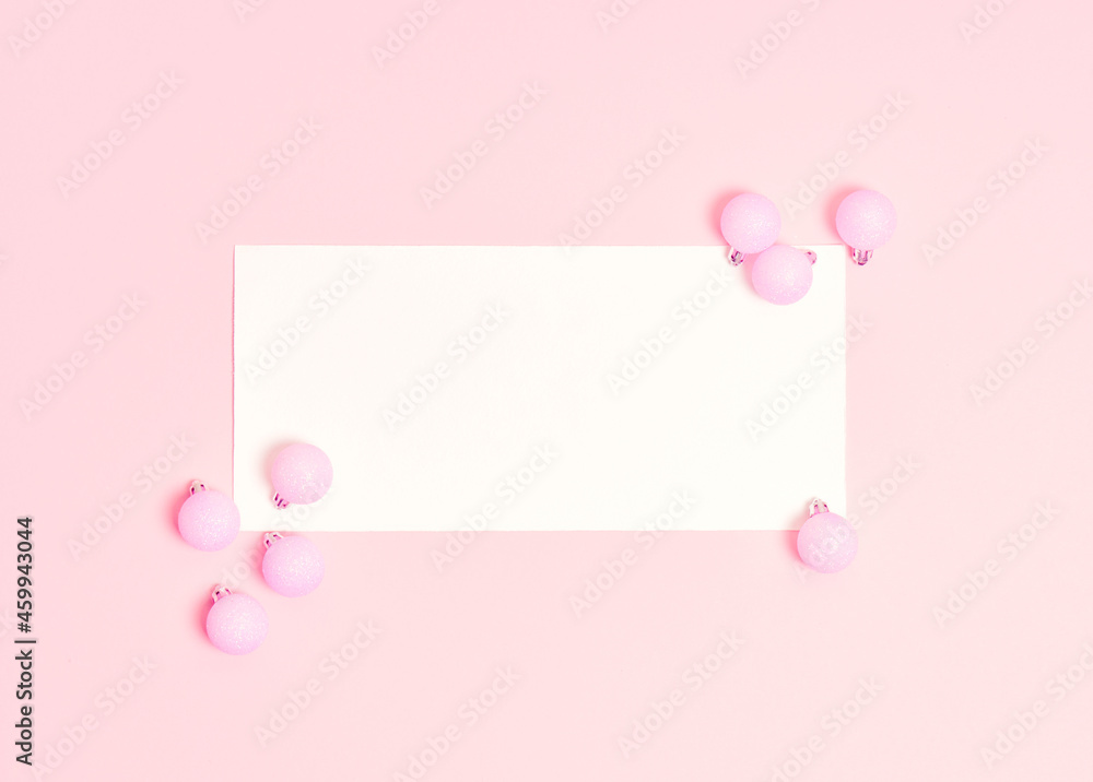 Top view of Christmas composition on pastel pink background. Holiday greeting card with copy space to text.