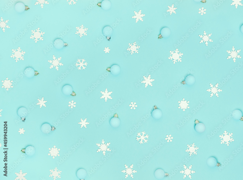 Christmas pattern. New Year decorations on blue background. Snowflakes, сhristmas decorations. Flat lay, top view. Christmas pattern. New Year decorations on blue background. Snowflakes, сhristmas decorations. Flat lay, top view.