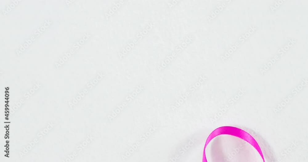 Animation of pink ribbon on white background Animation of pink ribbon on white background