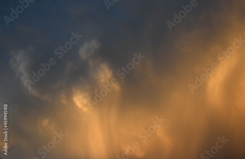 rain falling down from a cumulonimbus cloud with brigth sunligth © Nature Photos
