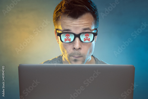 Man with computer problems in front of a laptop
