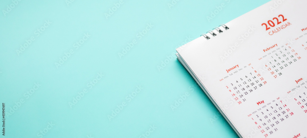 2022 calendar page on blue background business planning appointment meeting concept 2022 calendar page on blue background business planning appointment meeting concept