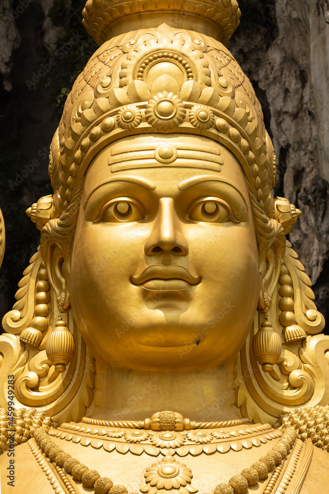 Closeup of the huge statue Sri Muruga, the Hindu god of war, near the Batu Caves, in the Gombak District, Selangor, Malaysia