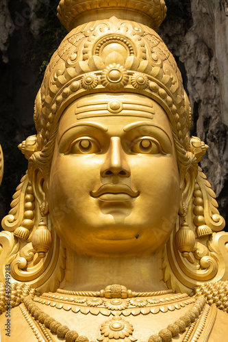 Closeup of the huge statue Sri Muruga, the Hindu god of war, near the Batu Caves, in the Gombak District, Selangor, Malaysia