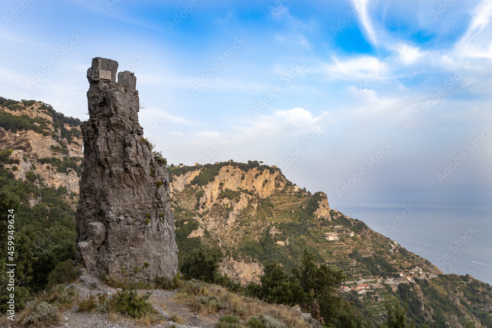 a tooth-shaped rock on the path of the gods (sentiero degli dei) on the Amalfi Coast. Agerola, Positano, Campania, Italy