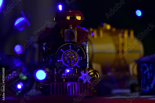 Typical gift toy (train) depicted on a Christmas background © Alfredo Q.