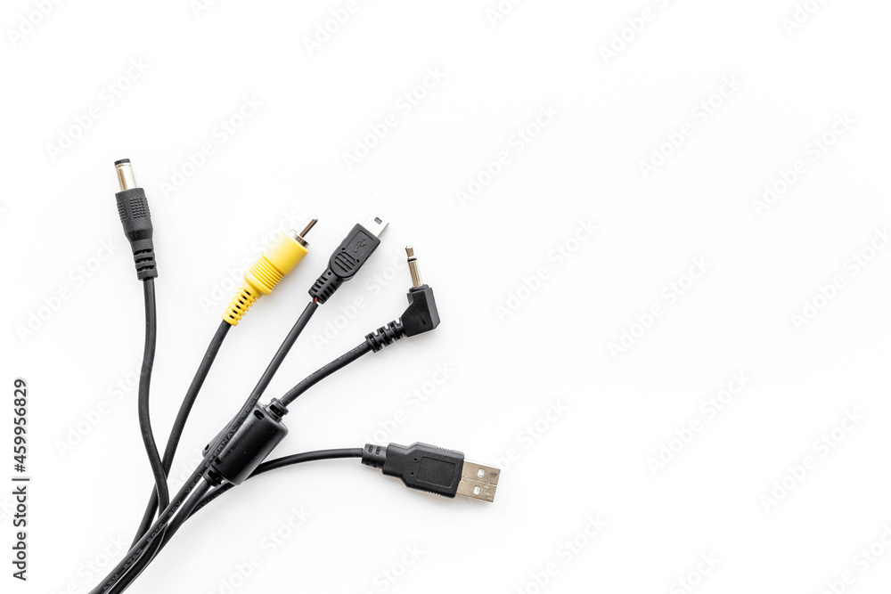 Cables for charging smartphone or laptop, top view Cables for charging smartphone or laptop, top view