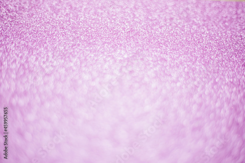 Blurry shimmering background of pink sequins. Silver glitter, light abstract bokeh texture. Drawing design.