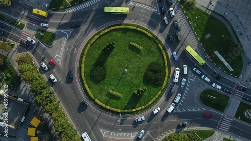 Top view of traffic of people, cars and buses at rush hour at circular junction