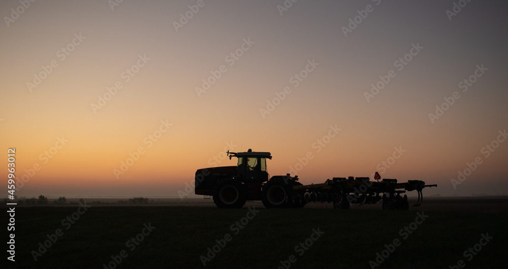 Fototapeta premium tractor at sunset