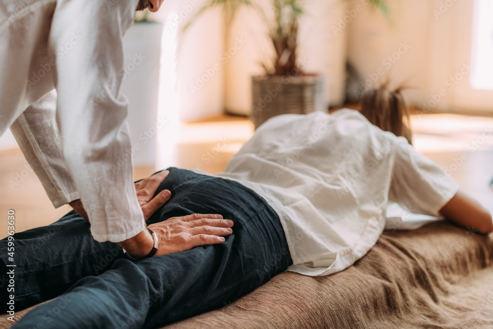 Shiatsu Treatment for Sciatica Pain. Stock Photo Adobe Stock