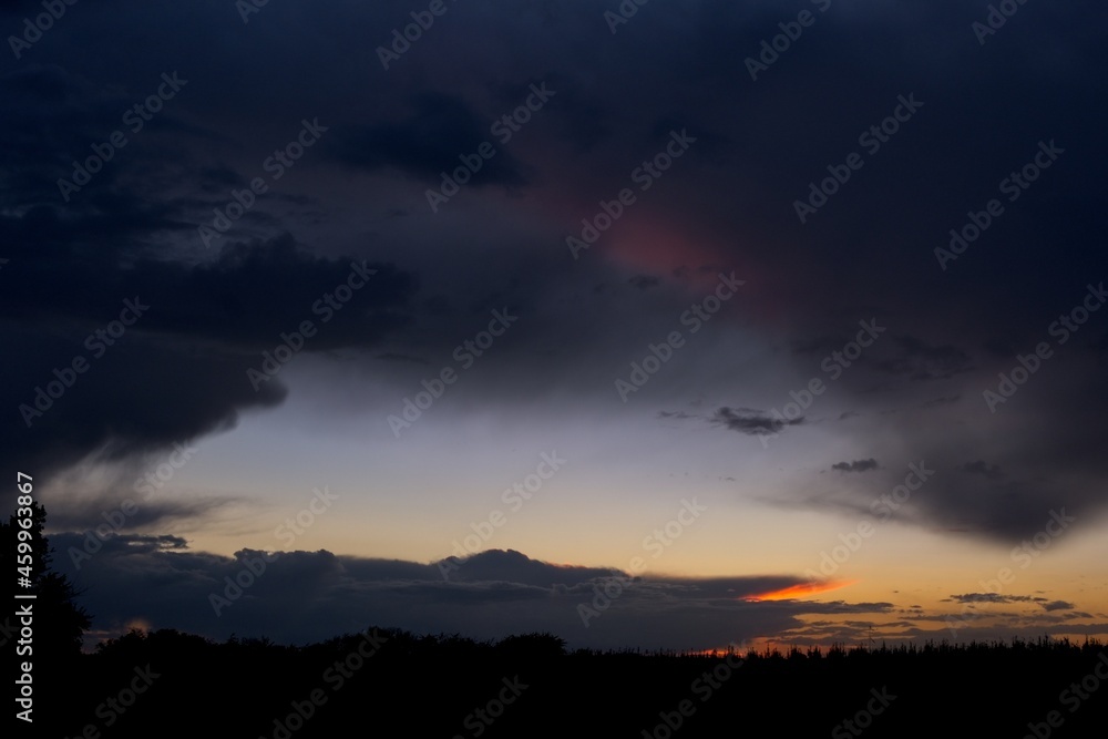 Distant thunderstorm after sunset from a disbanded airfiled