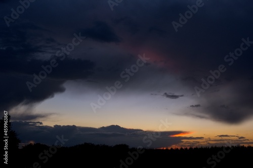 Distant thunderstorm after sunset from a disbanded airfiled