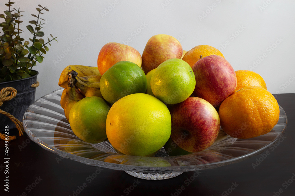 Fruit bowl full of fruits on the table. Fruit bowl full of fruits on the table.