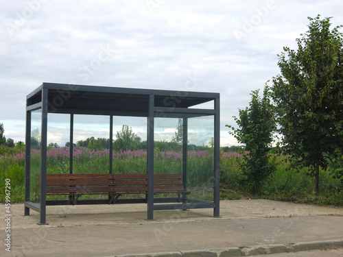 Fototapeta Naklejka Na Ścianę i Meble -  bus stop pavilion in the village with a bench without an urn