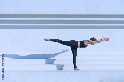 Woman standing in yoga pilates pose outdoors