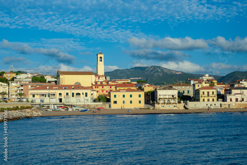 Panorama of the city of San Vincenzo, seen from the sea. Blue sky and clouds. Livorno, Tuscany, Italy